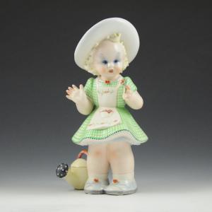 Girl with flower and watering can